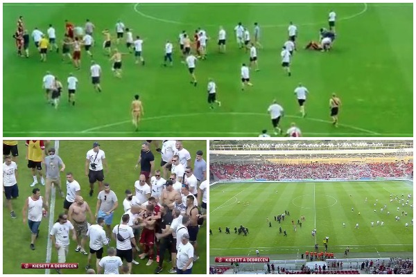 Kaos/ Tifozët futen në fushë dhe godasin lojtarët (VIDEO)